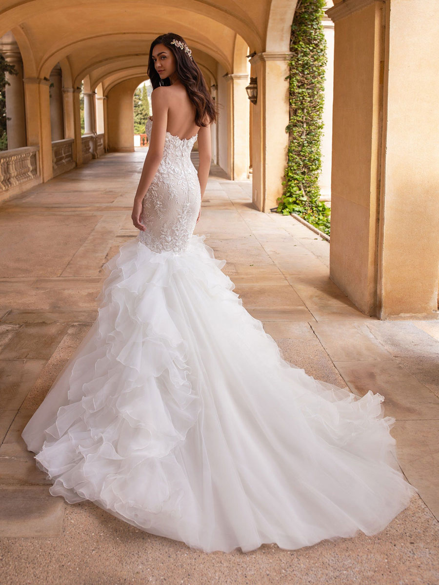 Mermaid dress with open back along with beaded appliques and a sweetheart neckline 